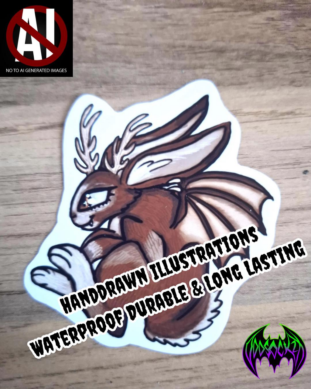 Handdrawn illustration of a brown  rabbit creature  with bat wings & antlers  on a wooden surface with text "Handdrawn Illustrations , waterproof durable & long lasting